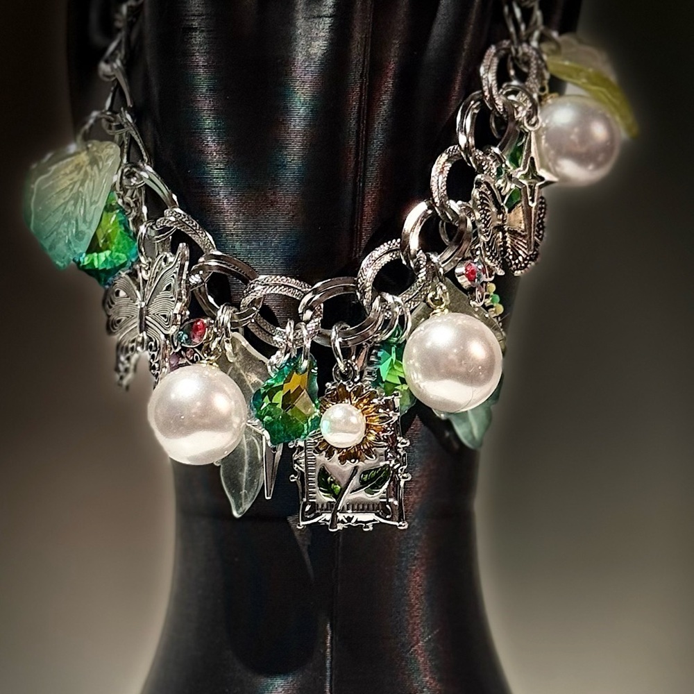 Elegant Silver Charm Bracelet with Pearls and Green Accents